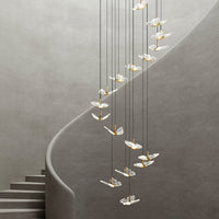 spiral smoke grey crystal butterfly pendant lighting hanging from the ceiling in the staircase
