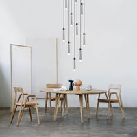 cylinder shade pendant light hanging over a round table