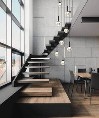glass globe pendant lighting hanging from staircase