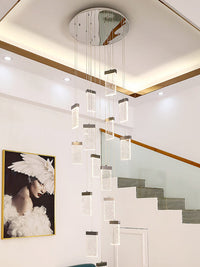 square crystal bubble pendant light hanging from ceiling besides staircase