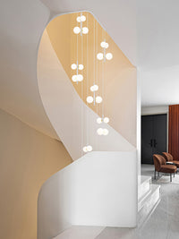 multi opal globe pendant lighting hanging in the spiral staircase