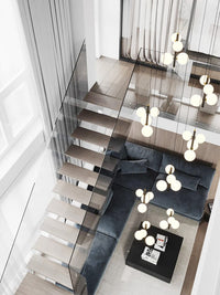 multi opal globe pendant lighting hanging besides the staircase