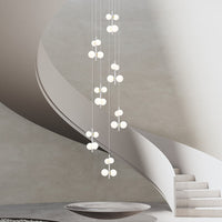 multi opal globe pendant lighting hanging in the spiral staircase