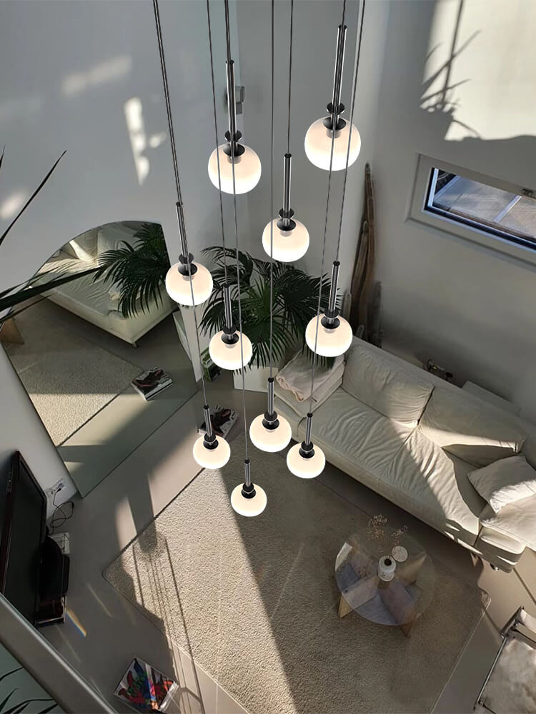 multi cream glass globe pendant lighting is hanging for living room