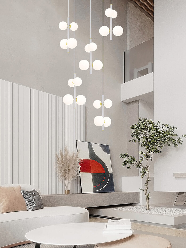 multi opal globe pendant lighting is hanging over a round table in living room