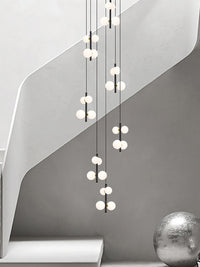 multi opal globe pendant lighting hanging in the staircase